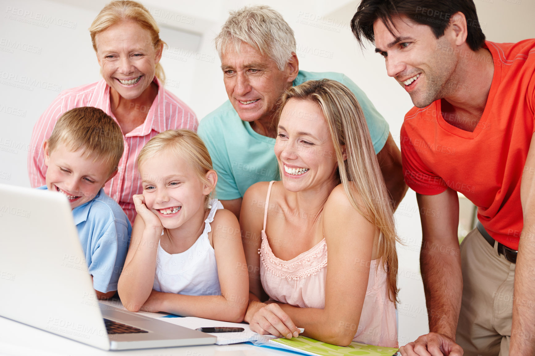 Buy stock photo Happy, family and grandparents in lounge on laptop with children for entertainment at home for development. Parents, siblings and bonding on vacation to visit grandma, grandpa and childhood house
