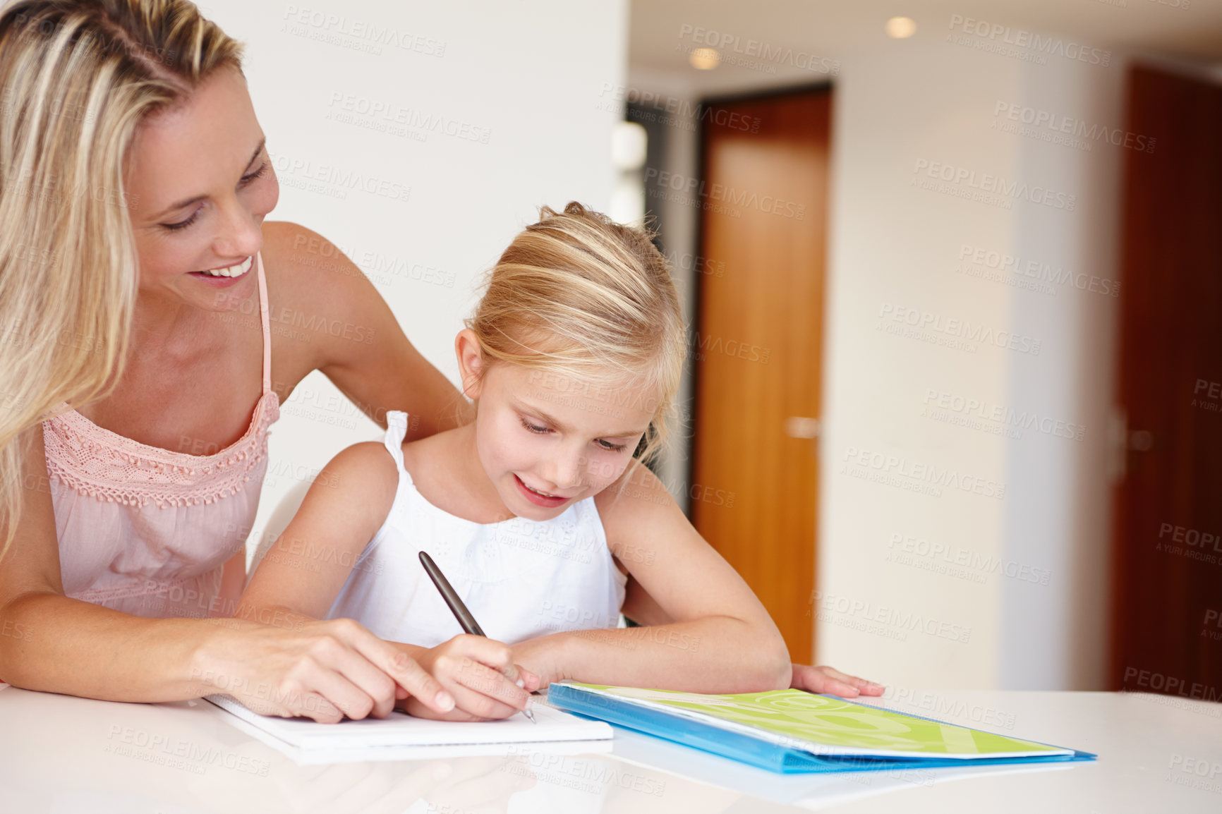 Buy stock photo Mom, happy and child writing on notebook for development, learning or educational training. Woman, girl and book smile doing homework in living room for bonding, studying or tutoring after school