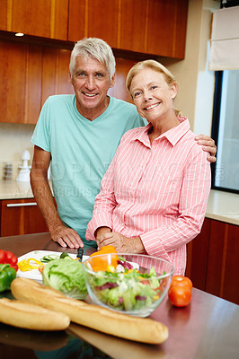 Buy stock photo Senior man, woman and happy in cheerful, smile and cooking in kitchen at home for dinner, plans and family. Mature couple in preparing, food or salad for healthy, eating and nutrition in house