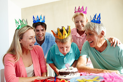 Buy stock photo Birthday party, smile and family for celebration with cake for children and gathering in house. Mother, father and senior people with kid and bonding with love and happy for blow candle in home