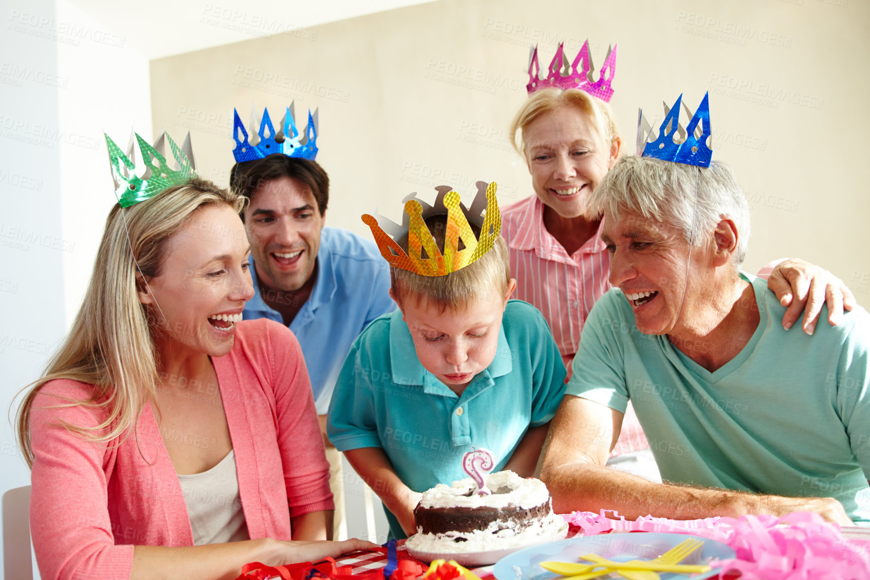 Buy stock photo Birthday party, smile and family for celebration with cake for children and gathering in house. Mother, father and senior people with kid and bonding with love and happy for blow candle in home