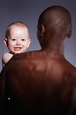 Buy stock photo Portrait of a cute little boy being held by an adult male