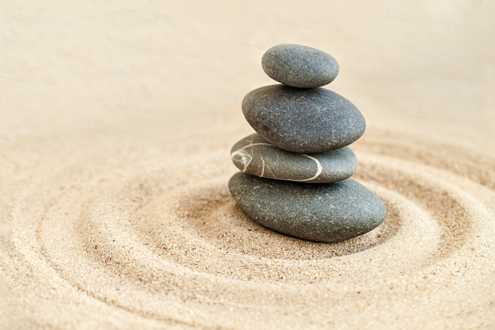 Buy stock photo Shot of a stones stack in sand