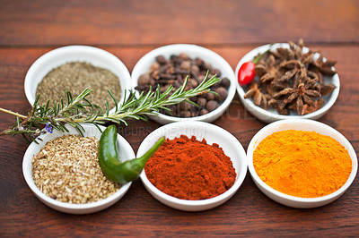 Buy stock photo Food, turmeric and spices on table top for cooking gourmet meal, pepper seasoning or paprika flavor. Vegetables leaf, kitchen condiments and variety of plant herbs in bowls for brunch or healthy diet