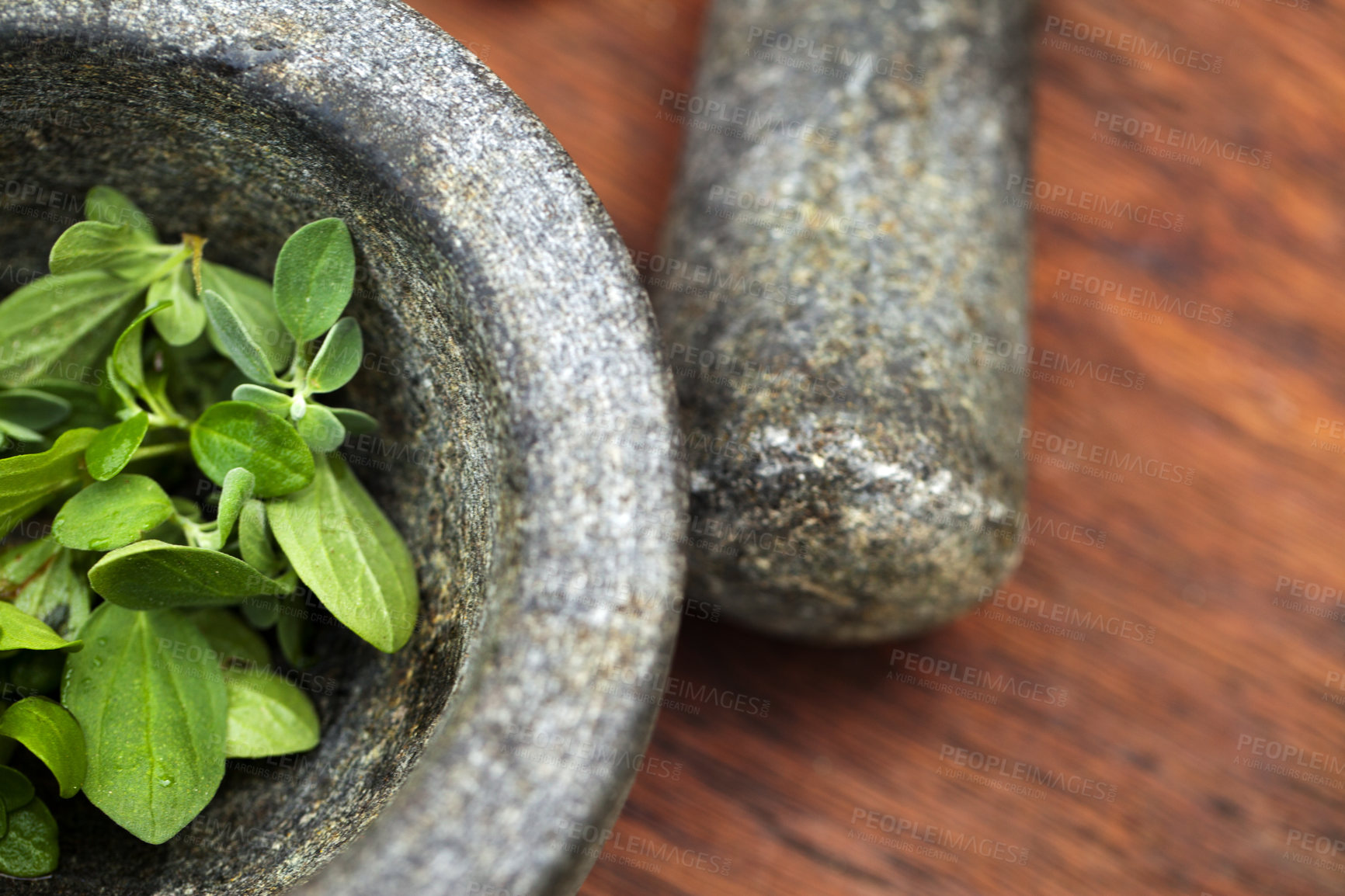 Buy stock photo Plant cooking, mortar and pestle for herbs on table top in kitchen. Vegetables, food and equipment for crushing basil leaf, plants or spices for gourmet meal, seasoning and flavor for healthy diet.