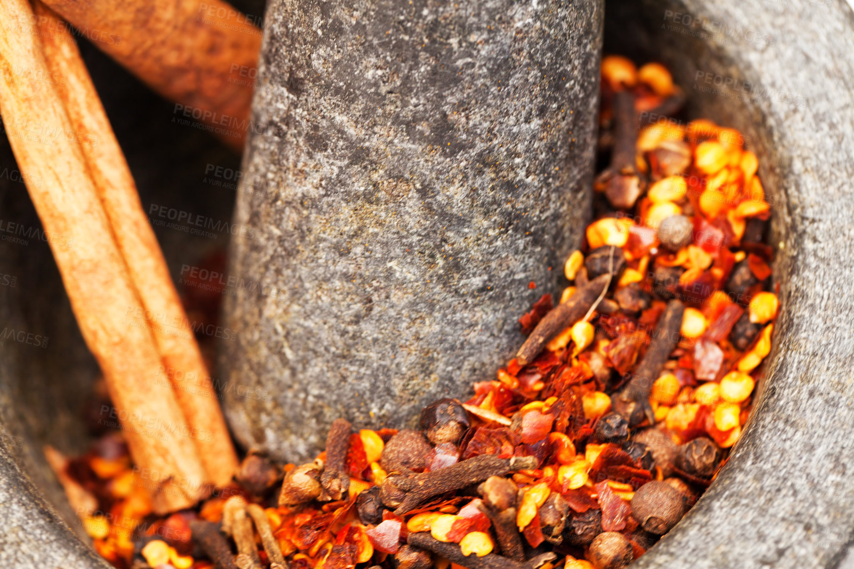 Buy stock photo Closeup, herbs and crush spices for curry on stone mortar or bowl or grind for powder seasoning and on close up. Nutrition, diet and garlic or pestle in coriander or natural salt for taste in food 