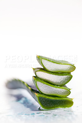 Buy stock photo Beauty, water and aloe vera plant on a white background for natural treatment, wellness and skincare products. Spa aesthetic, advertising and leaf in studio for organic, healthy and herbal ingredient