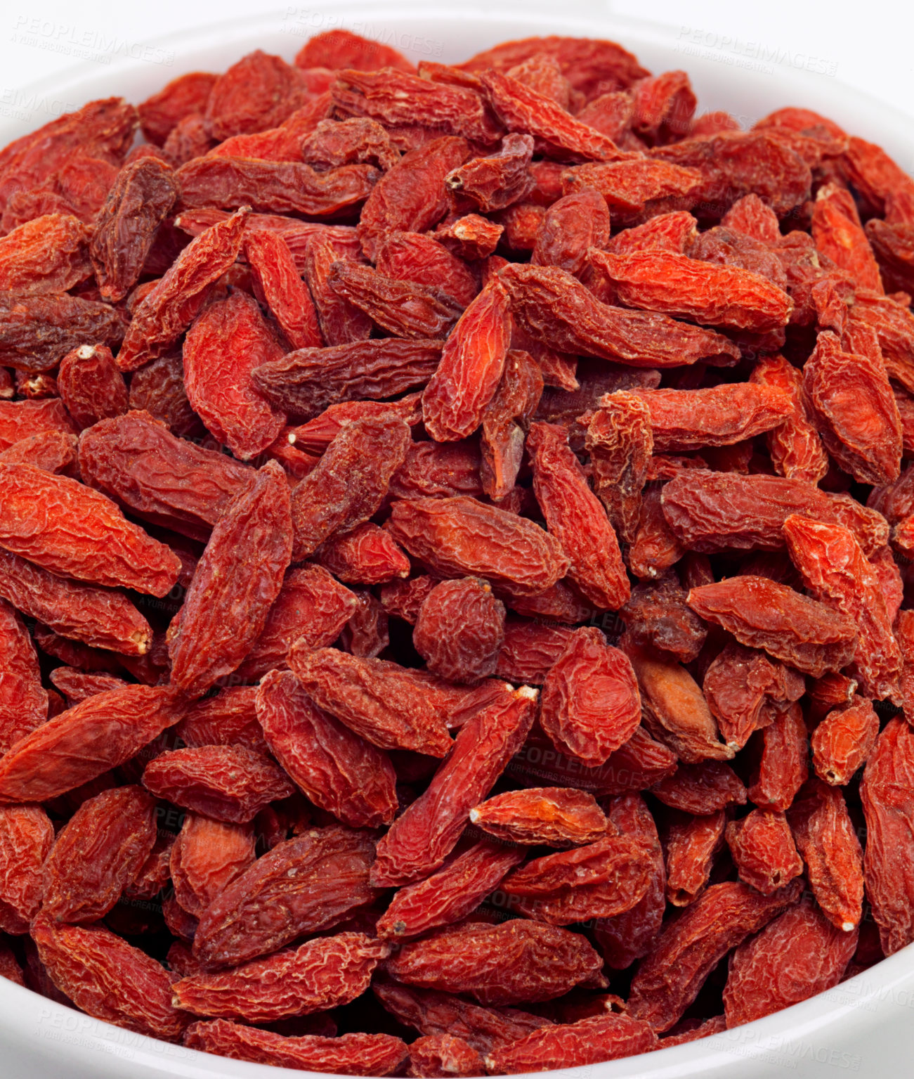 Buy stock photo Dried, goji berries and bowl in studio for nutrition, natural, organic and antioxidant as snack for full body. Fresh, fruit and red seeds produce vitamin c, fibre and nutrients for weight loss 