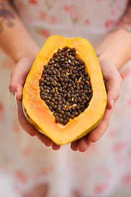 Buy stock photo Hands, person and papaya in half with nutrition for healthy eating with seeds, nutrients and wellness. Food, pawpaw and diet with fruit for weight loss with vitamin c for balance with freshness