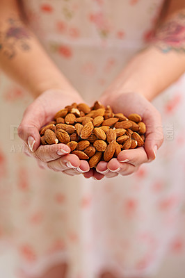 Buy stock photo Bunch, almond and nuts in woman hands as a vegetarian for healthy, organic and balanced diet by eating nutritious snacks. Person, fresh and natural ingredients with vitamin from vegan nutrition