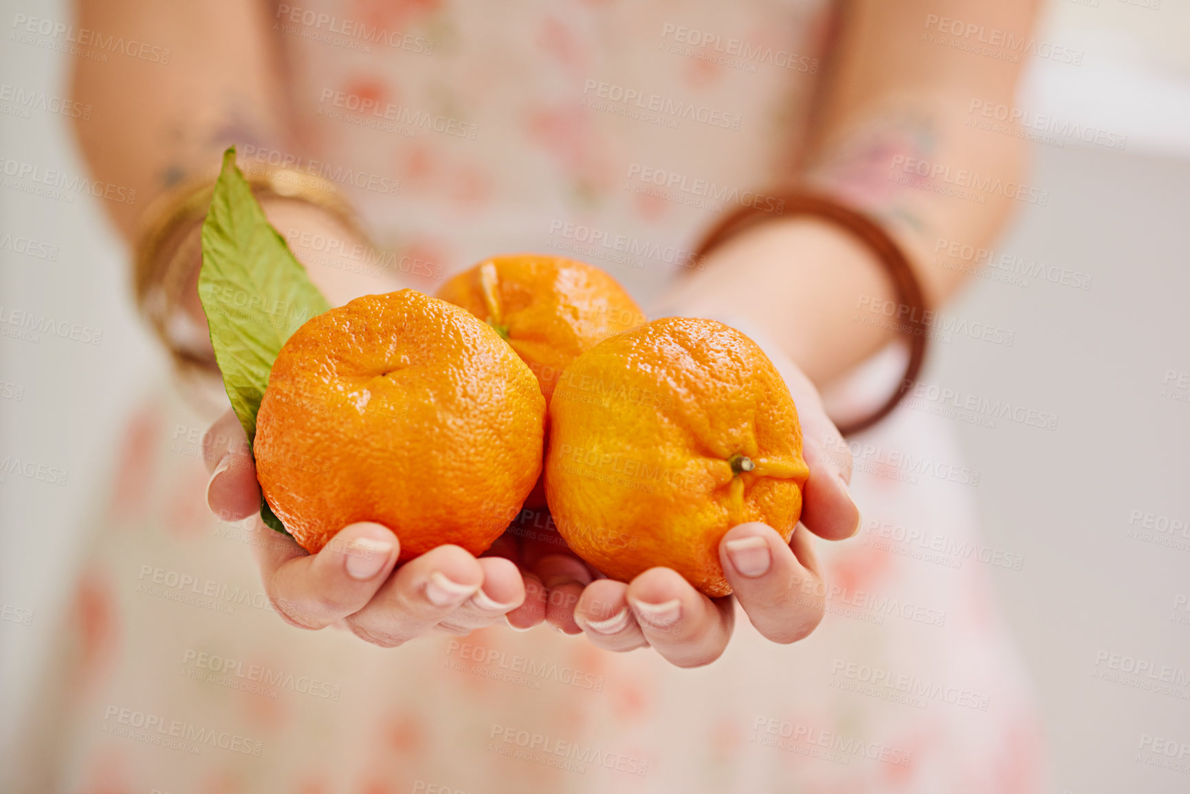 Buy stock photo Vitamin C, citrus and tangerine with fruit for wellness, cardiovascular health or fiber in home. Nutrition, healthy and food as snack, antioxidant and juice for organic, eating and diet in hands