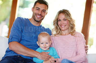 Buy stock photo Couple, baby and portrait on sofa with smile at house, learning or development and bonding. Man, woman and child in living room with closeup on couch for togetherness, family time or happiness