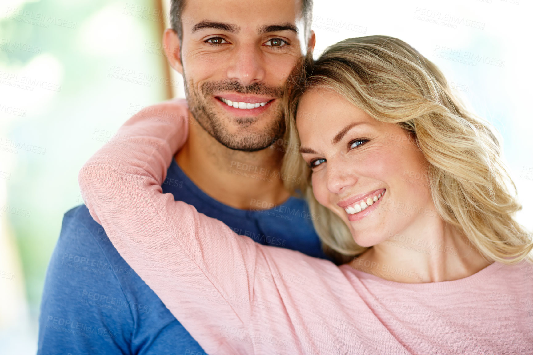 Buy stock photo Portrait of an affectionate young couple at home
