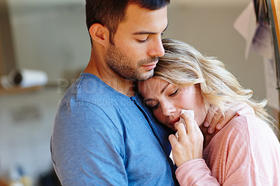 Buy stock photo Shot of a young man consoling his upset girlfriend 