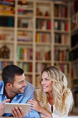 Buy stock photo Happy couple, tablet and online in house with smile for future holiday, internet and connection. Smiling man, woman and tech in home with happiness for romantic vacation, search travel and bonding