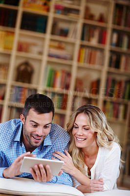 Buy stock photo Happy, man and tablet with wife at house in lounge for weekend away with love, fun and peace as partners. Married, couple and vacation for break, relaxing and connecting with technology in home.