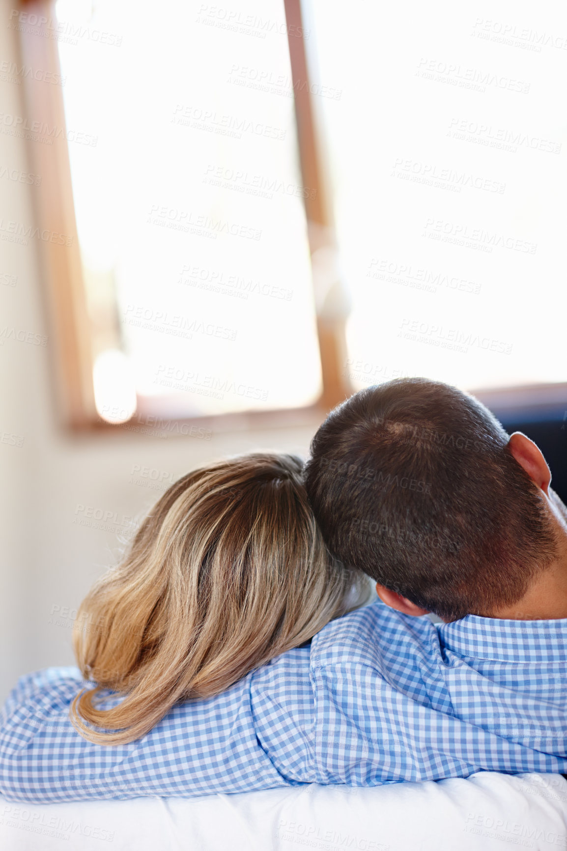 Buy stock photo Couple, hugging and love in house with couch for romance, sitting together and peaceful bonding. Man, woman and relaxing in living room with happiness for romantic time, comforting and rear view 