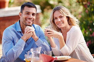 Buy stock photo Portrait, happy and couple eating breakfast in garden outside at table in morning. Married, man and woman on romantic getaway at house sitting on patio talking, coffee and care for relationship