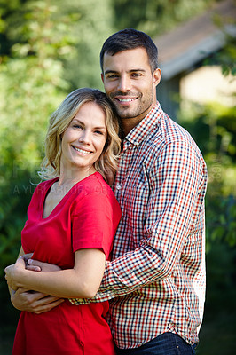 Buy stock photo Portrait of a happy young couple standing outside