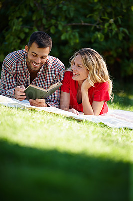 Buy stock photo Couple, grass and picnic with book in portrait for relax, reading or together with notebook. Man, woman and nature for stress relef or break and bonding, chill or park and relationship with holiday