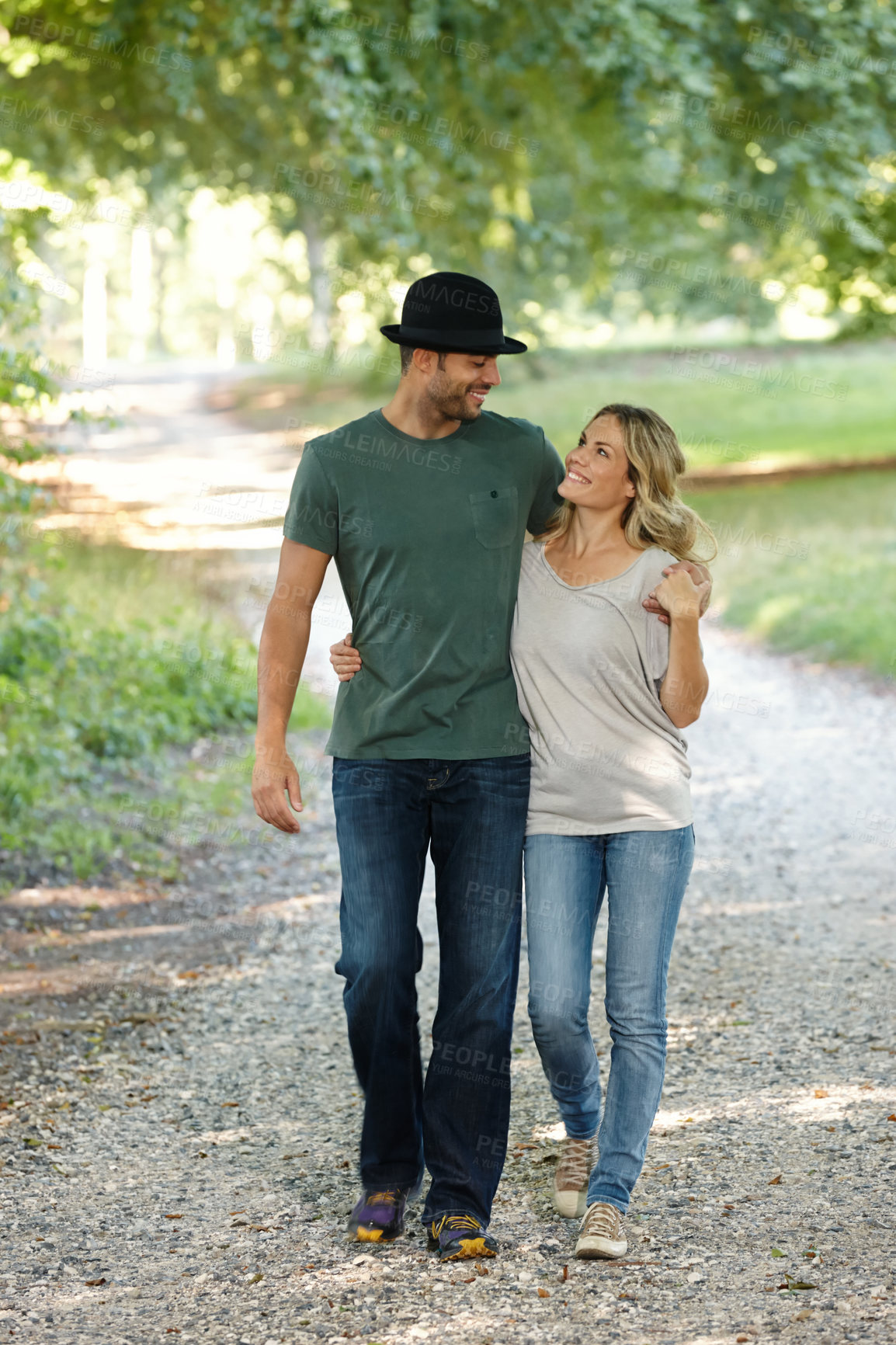 Buy stock photo Couple, hug and happy walking in park for love, bonding with care and support in healthy relationship. Man, woman and outdoor for date with romance, trust and commitment for marriage or partner