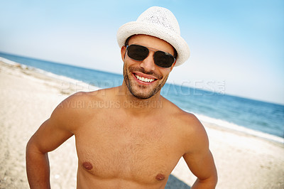 Buy stock photo Man, shirtless and portrait at beach for travel outdoor and relax for break in afternoon. Young person, smile and happy for recreation on sand by ocean for weekend fun and trip for summer holiday 