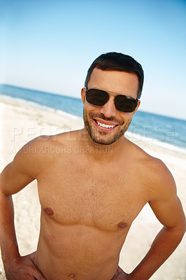 Buy stock photo Portrait, happy man, and sunglasses at Brazilian island with blue sky for summer vacation, topless and skin. Smile, beach and face of male tourist with water in outdoor for travel, sunny and holiday 