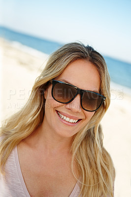 Buy stock photo Woman, sunglasses and travel to beach on vacation, smile and peace on sand or relax by water. Female person, happy and tropical ocean for tranquil on weekend, outdoor nature and confident by ocean