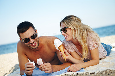 Buy stock photo Couple, ice cream and beach for relax and travel outdoor for  relationship and dating. Boyfriend, girlfriend or tourist with gelato dessert and smile by ocean for rest on towel in summer for holiday 