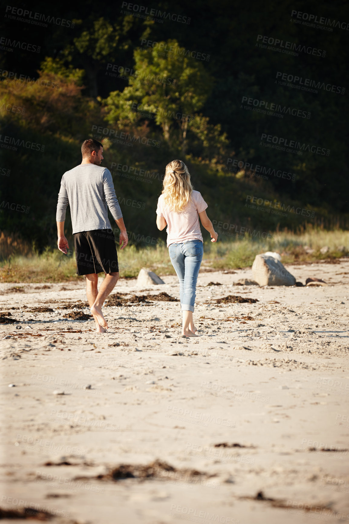 Buy stock photo Couple, walking and bonding on outdoor beach sand, peace and travel to nature for holiday. People, back and calm stroll on weekend or vacation, love and date for relationship or marriage and trip