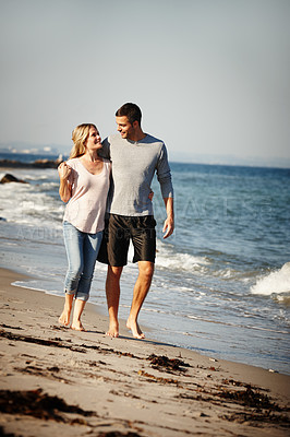 Buy stock photo Couple, walking and hug on sand of beach, peace and travel to nature for holiday. People, embrace and calm on weekend trip or vacation, love and date for relationship or marriage and ocean waves
