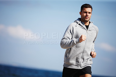 Buy stock photo Man, jog and exercise on beach for fitness, workout and body health for physical training. Male runner or athlete and serious for run, cardio or active recreation in summer outdoor ocean on mockup