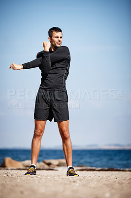 Buy stock photo Man, stretch and beach for exercise with fitness in dynamic pose for health with workout in preparation for running. Male person, outdoors and healthy for performance with warm up for body care