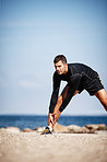 Stretching his hamstrings