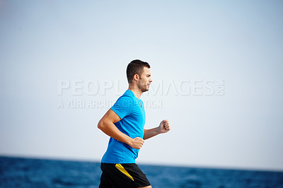 Buy stock photo Running, athlete and man, water and outdoor with energy for practice, exercise and health in nature. Workout, runner and training for marathon, beach and performance of speed for sports and person