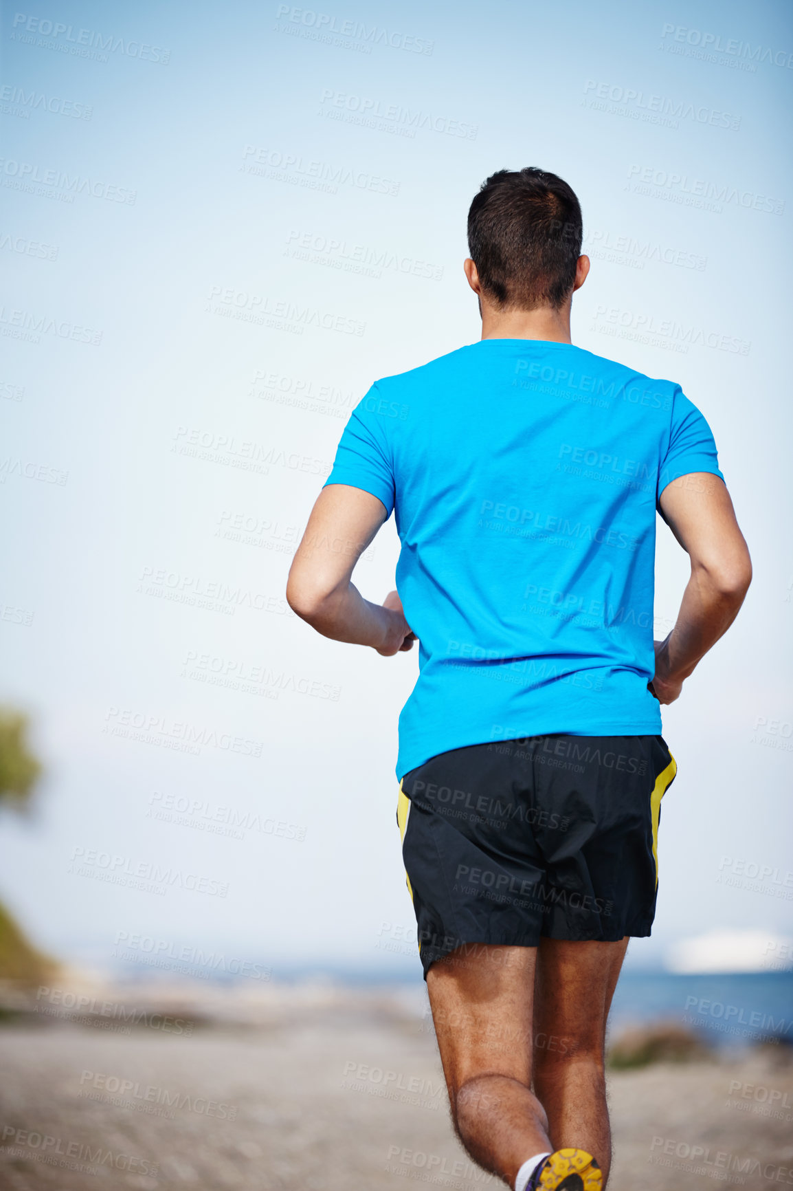 Buy stock photo Sporty, man and jogging in outdoor for exercise, health and wellness in nature for workout or fitness. Male athlete, training and cardio with endurance, muscles and strength for healthy living or gym