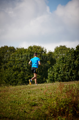 Buy stock photo Sport, man and running in nature for fitness, health and wellness in outdoor for workout or exercise. Male athlete, training and cardio with endurance, muscles and strength for healthy living or jog