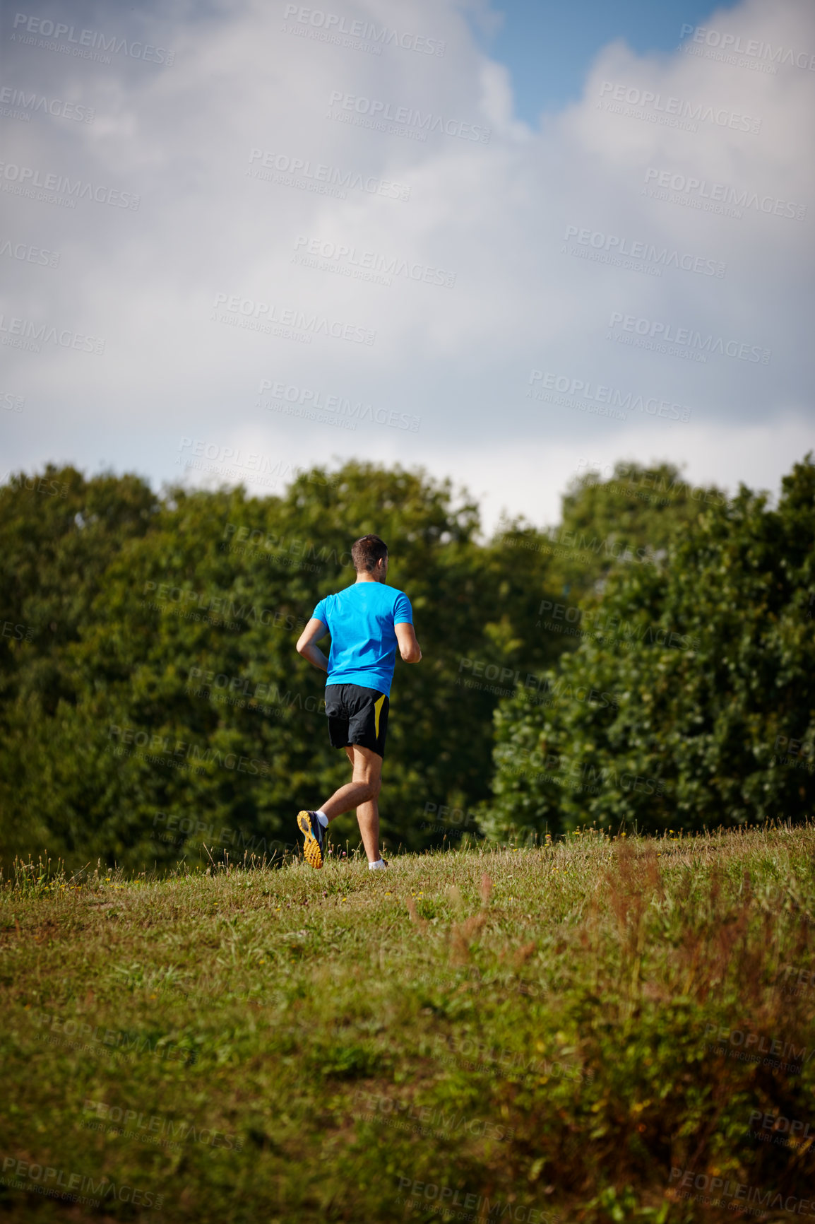 Buy stock photo Sport, man and running in nature for fitness, health and wellness in outdoor for workout or exercise. Male athlete, training and cardio with endurance, muscles and strength for healthy living or jog