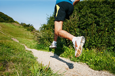 Buy stock photo Running, man and legs in outdoor for fitness, health and wellness in path for workout, challenge or exercise. Male athlete, training and cardio with sports, muscles and strength for endurance or race