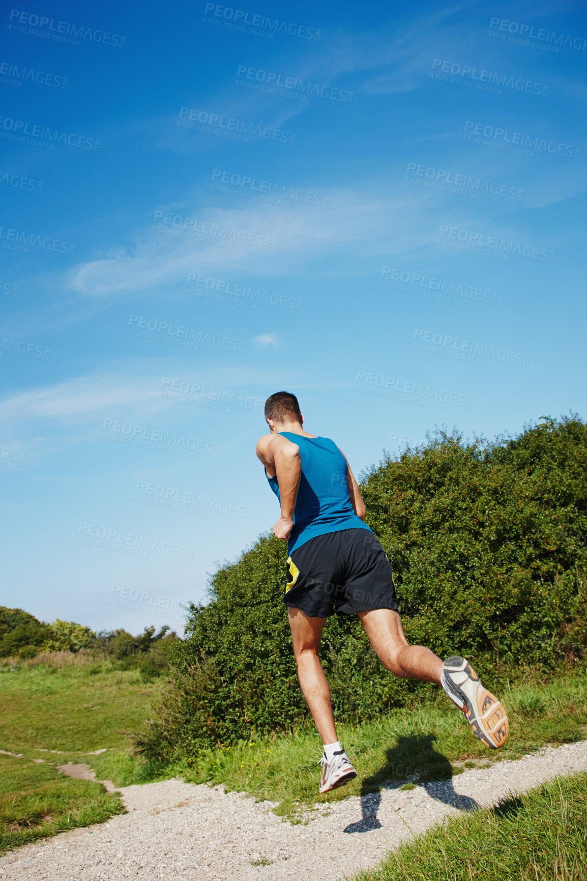 Buy stock photo Man, fit and running in outdoor for fitness, health and wellness in nature for workout or exercise. Male athlete, training and cardio with endurance, muscles and strength for healthy living or gym