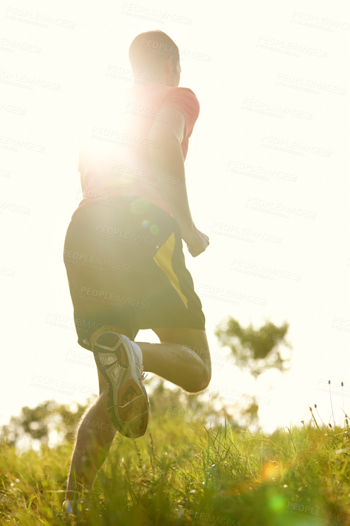 Buy stock photo Man, trail running and outdoors with athlete for endurance with training for physical fitness with lens flare. Male person, cross country and back for workout routine with balance in performance