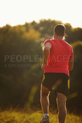 Buy stock photo Rearview, man and running for exercise, fitness goals and workout for body health and physical training outdoor. Male runner or athlete and jog for cardio, strength or recreation on trail outside   