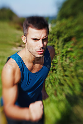 Buy stock photo Man, speed and trail running in nature for fitness, exercise and workout with motivation. Male athlete, runner and training outdoor for sports, health and wellness or cardio during summer with vest