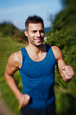 Buy stock photo Man, runner and trail running in nature for fitness, exercise and workout with motivation. Male athlete, speed and training outdoor for sports, health and wellness or cardio during summer with vest