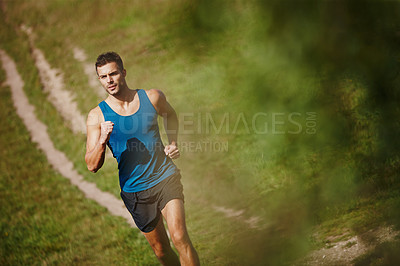 Buy stock photo Running, athlete and man, trail and outdoor with energy for practice, exercise and health in nature. Workout, runner and training for marathon, forest and performance of speed of male person