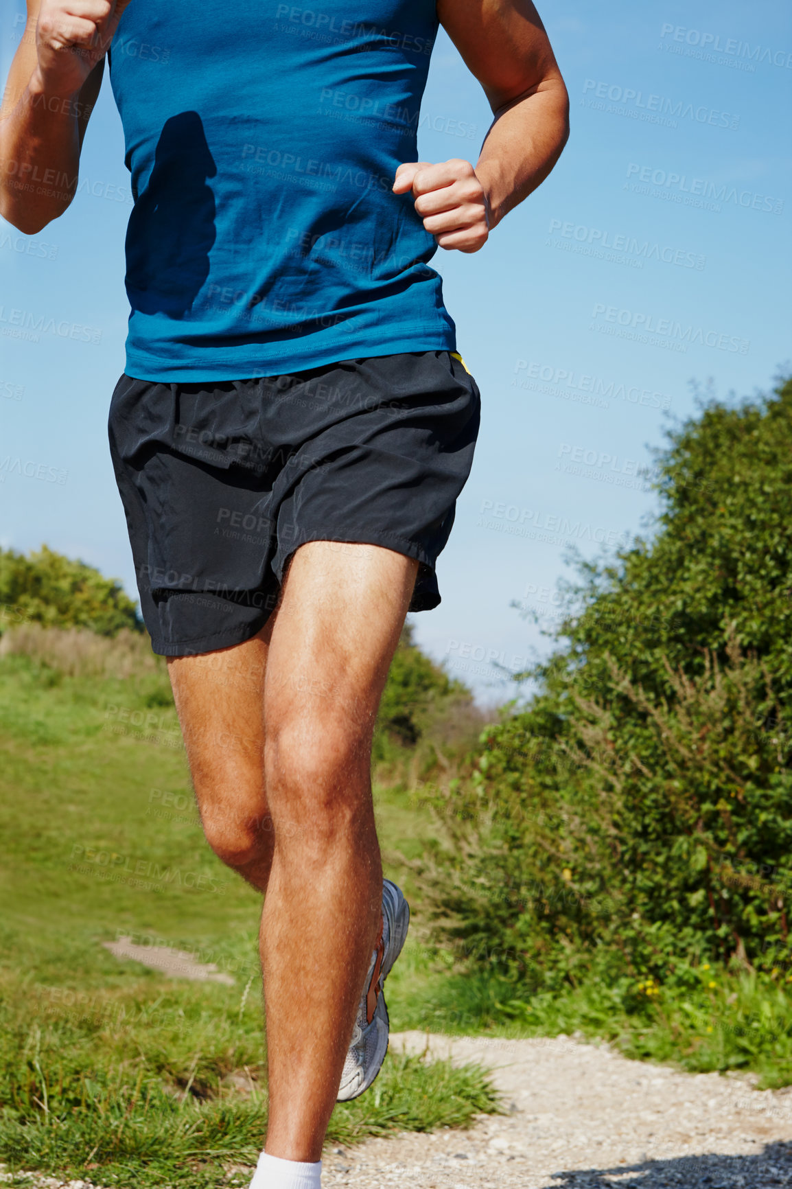 Buy stock photo Legs, man and running in nature for fitness, health and wellness in outdoor for workout or exercise. Male athlete, training and cardio with endurance, muscles and strength for healthy living