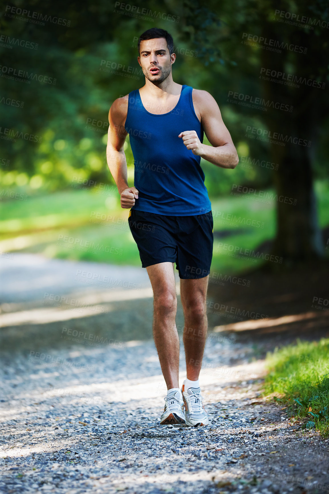 Buy stock photo Man, running and outdoor for fitness, health and wellness in nature for workout or exercise. Male athlete, training and cardio with endurance, muscles and strength for sports, marathon and jogging