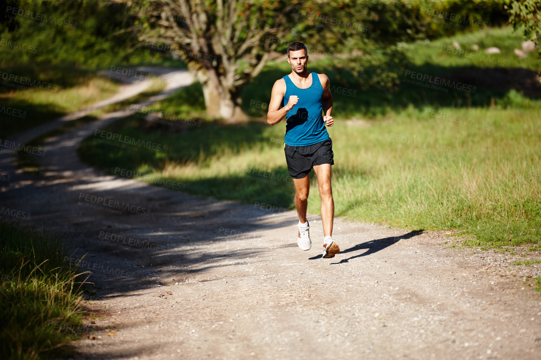 Buy stock photo Running, athlete and man, outdoor and practice with energy for sports, exercise and health in nature. Workout, runner and training for marathon, forest and performance of speed of male person