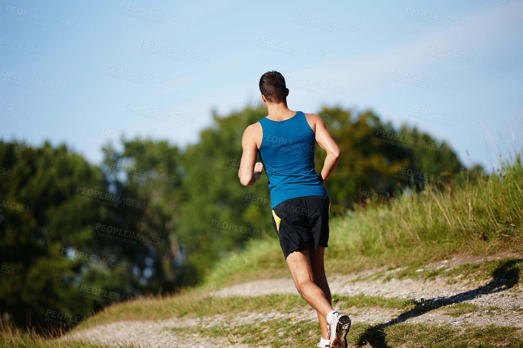 Buy stock photo Man, running and path in nature for fitness, health and race in outdoor for workout or exercise. Male athlete, strong and cardio with challenge, adventure and training for sports or marathon