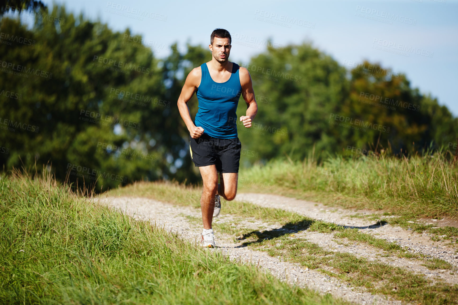 Buy stock photo Sporty, man and jogging in nature for fitness, health and wellness in outdoor for workout or exercise. Male athlete, training and cardio with endurance, muscles and strength for healthy living or gym